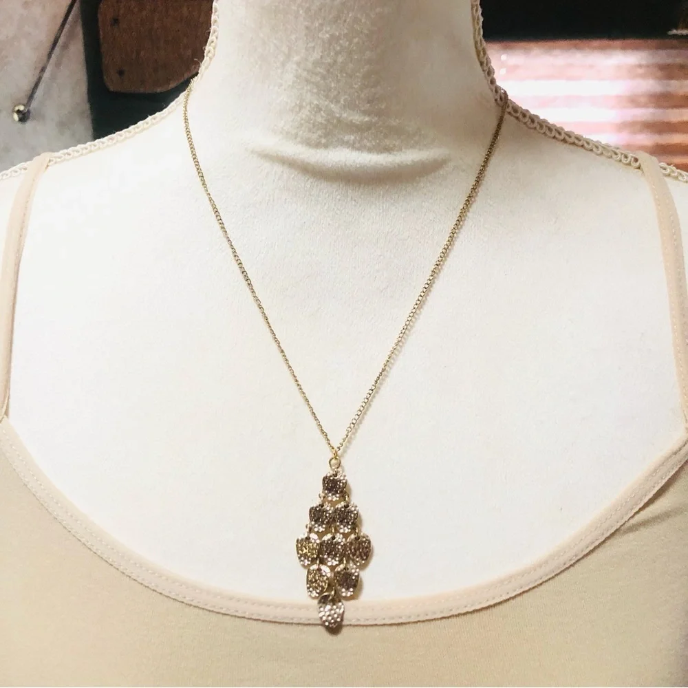 Shiny gold waterfall articulated pendant on chain necklace